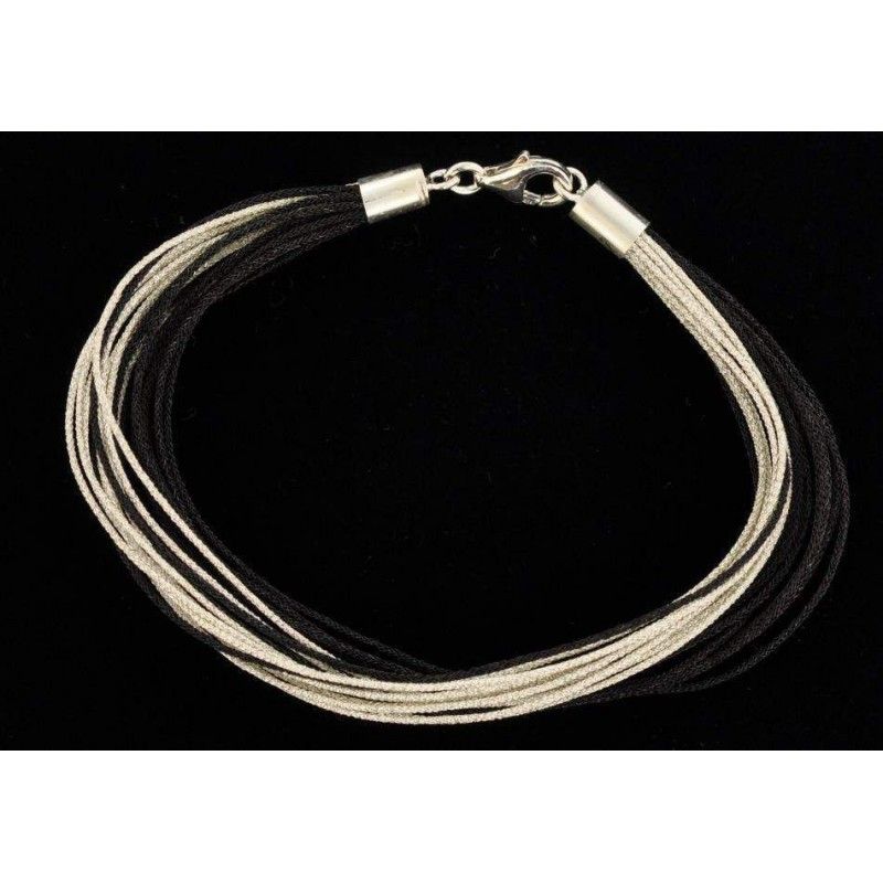 Bracelet fil de soie noir et argenté avec fermoir en argent.