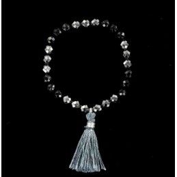 Bracelet perles d'onyx et d'hématite facettée avec pompon.