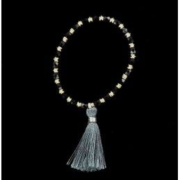 Bracelet perles d'onyx facettées, anneaux et pompon.
