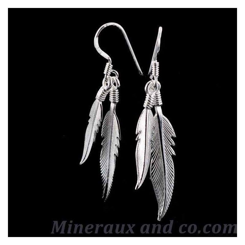 Boucles d'oreilles quatre plumes.